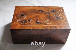 Vintage wooden box engraved in the Art Nouveau style with vegetal motifs.